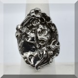 J047. Sterling embossed ring with woman's face. Size 6 - $85 